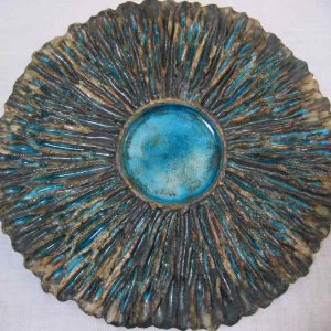 Sol africano, modelada en barro refractario, cubierta vidrio y oxido de cobre